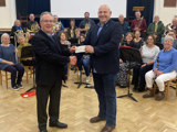 The £650 cheque being presented to the chaiman of the Central Committee Ben Rowe by Alan Gough makes up to over £1,000 raised on the music night at St Stephens church on the 12 November, 2022